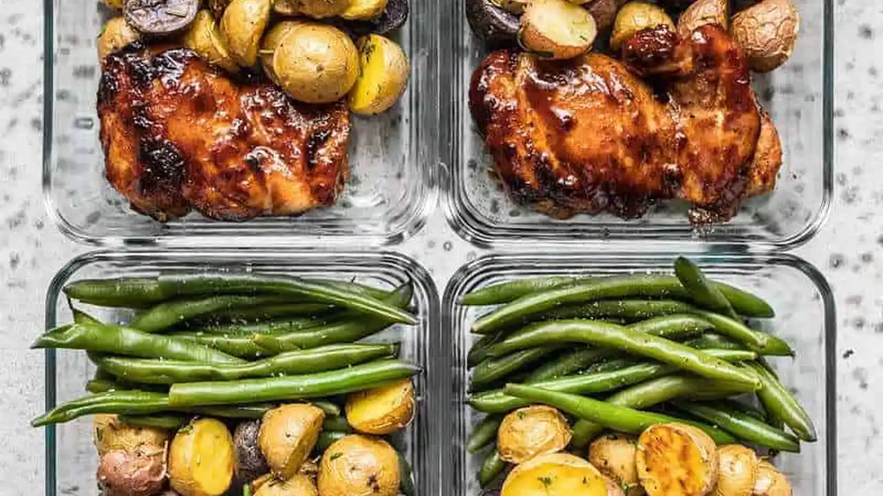 Two mint chocolate milkshakes with whipped cream and green sprinkles.